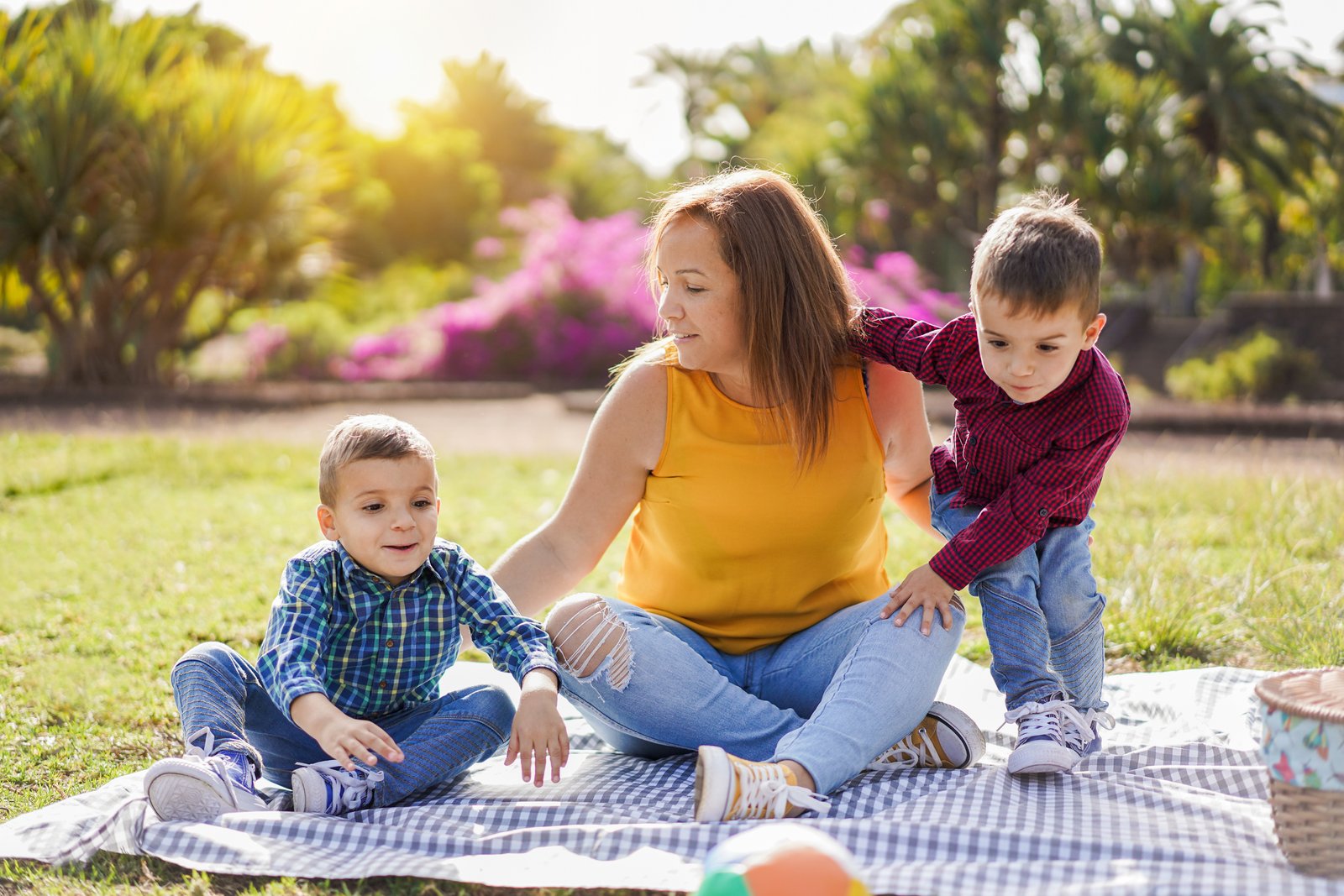 Mother with twin sons in nature park - Family, single parent and